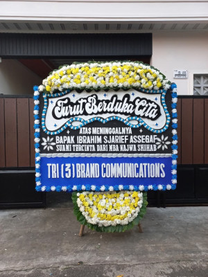 Papan Bunga Duka di Wapoga